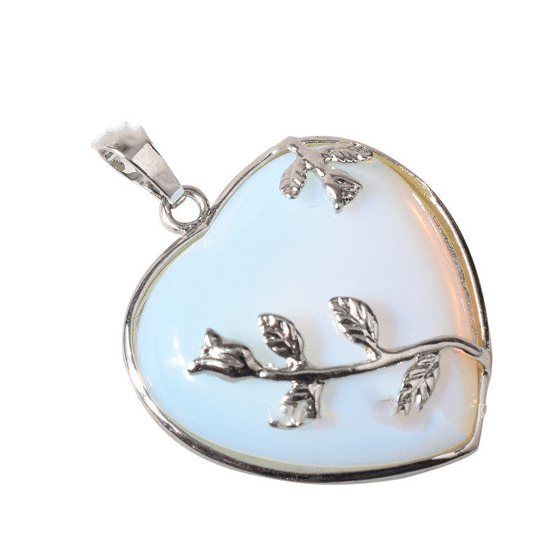 Rose quartz crystal heart pendant side view