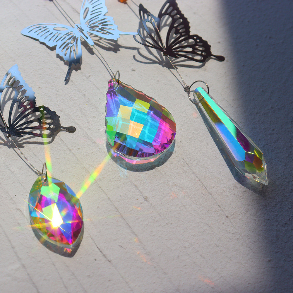 Rainbow light refraction through crystal wind chime outdoors