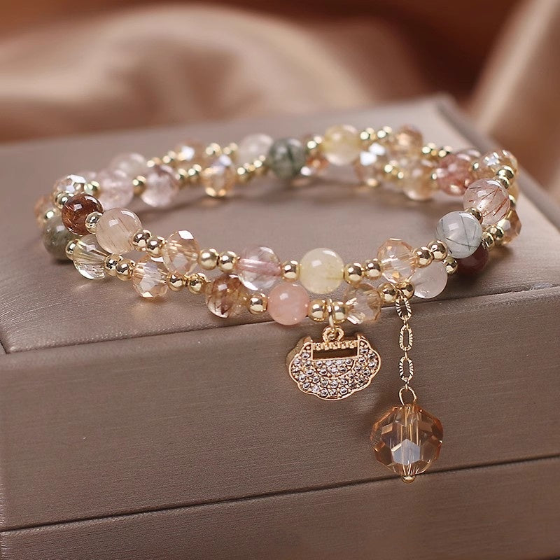 Golden hair crystal inclusions in quartz bracelet