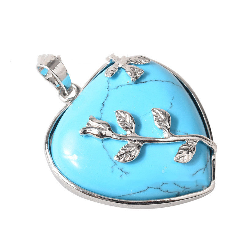 Natural pink rose quartz heart crystal pendant close-up