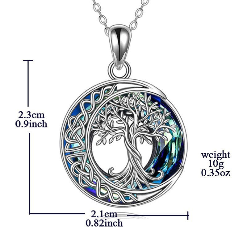 Crescent moon crystal pendant side view with blue electroplated chain