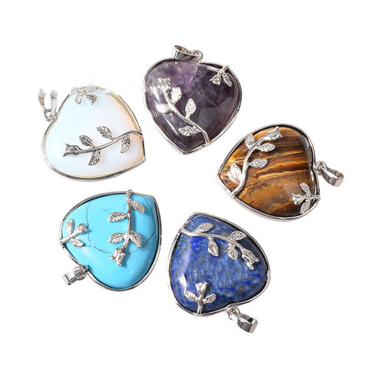 Rose quartz heart pendant necklace on white background