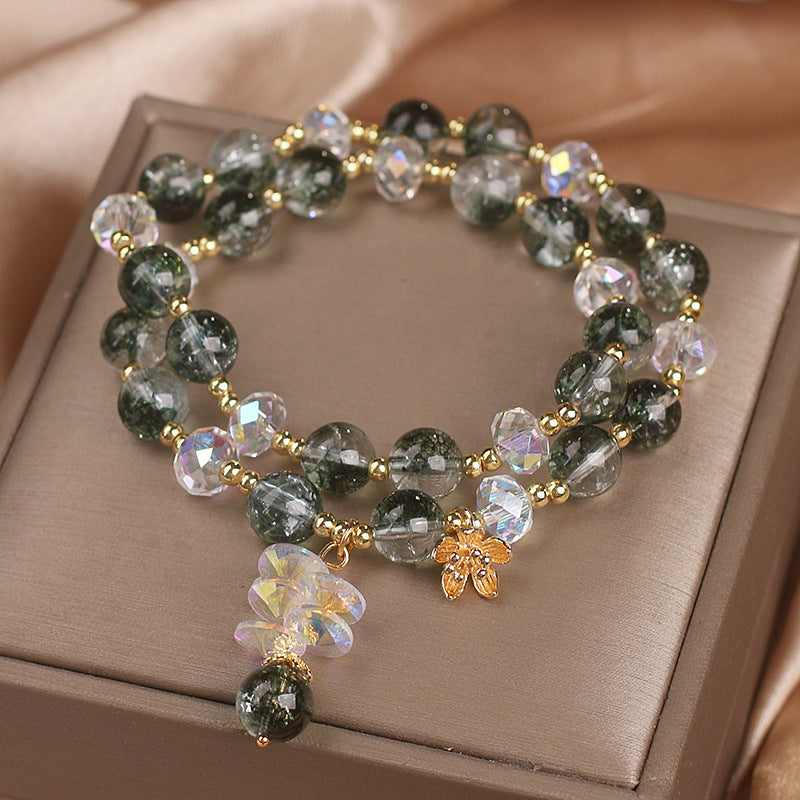 Green crystal bracelet showing adjustable elastic cord design