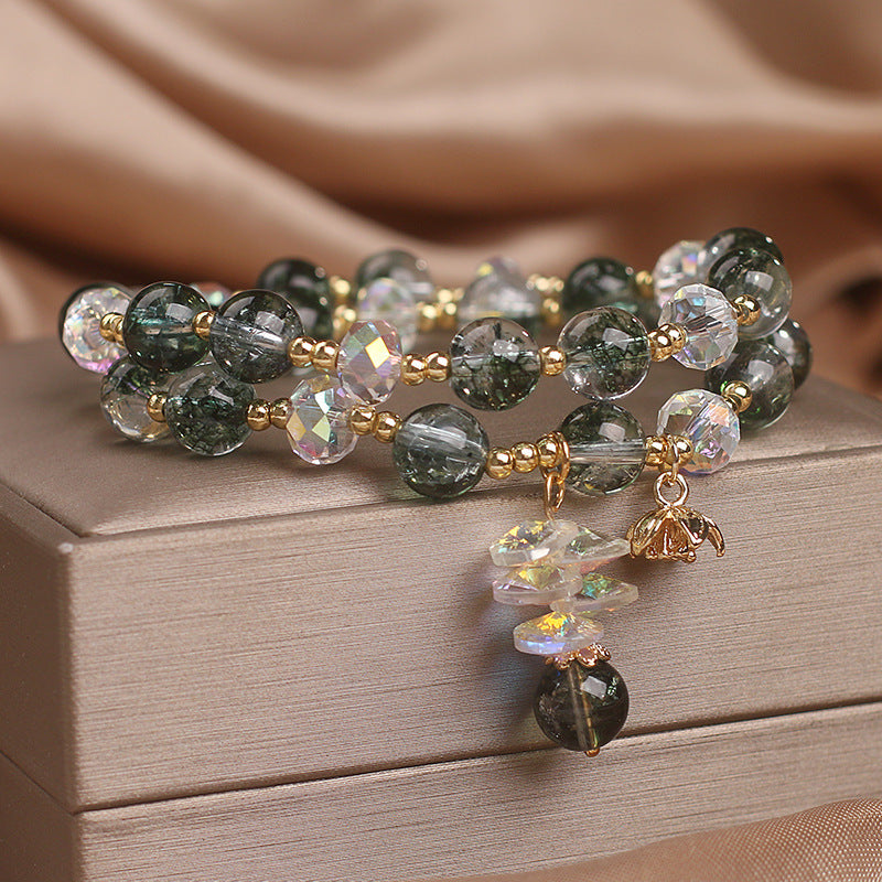 Side angle of green crystal flower charm bracelet jewelry