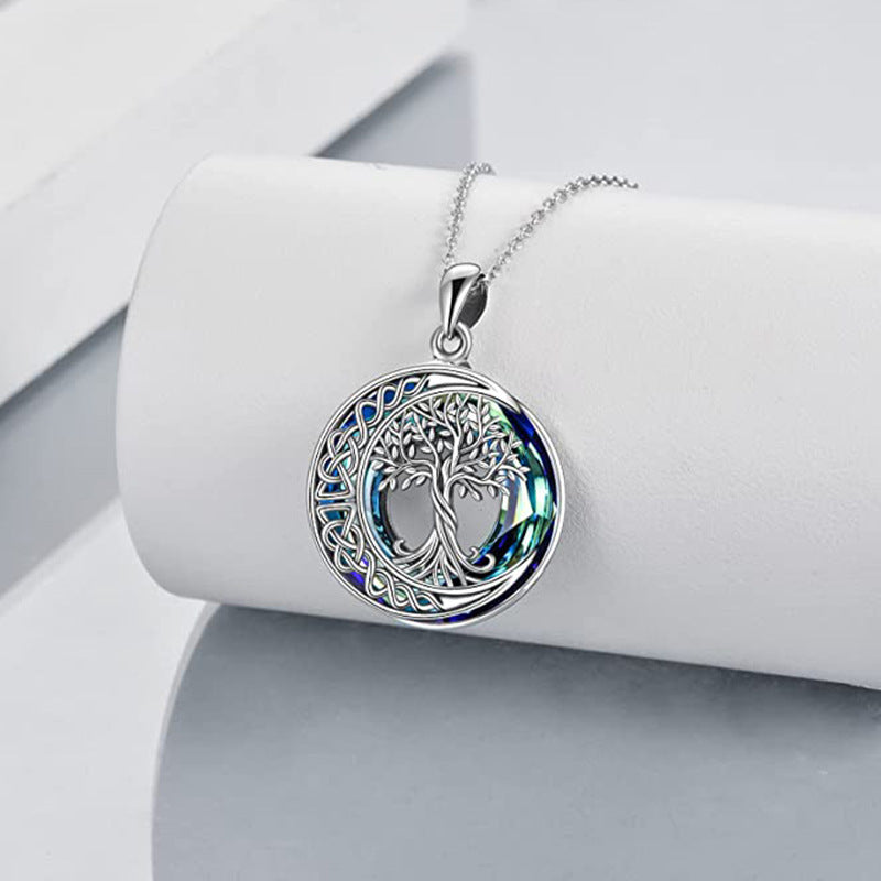 Blue chain celestial necklace with moon and tree symbolism